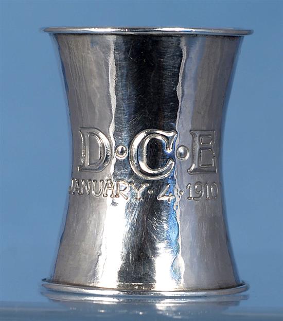 An Edwardian Arts & Crafts planished silver waisted napkin ring, by Omar Ramsden & Alwyn Carr, Height 55mm weight 1oz/33grms